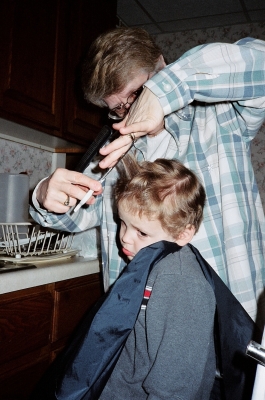 Grandma cuts Alex's hair